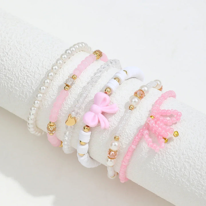 Set med Armband i Pärlälskande Båge